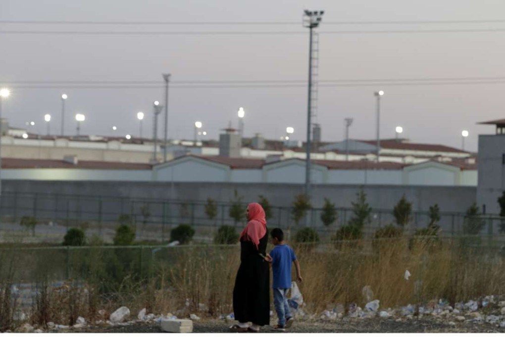 A woman and a boy walk outside a high security prison complex in Silivri, about 80km west of Istanbul. Photo: AP