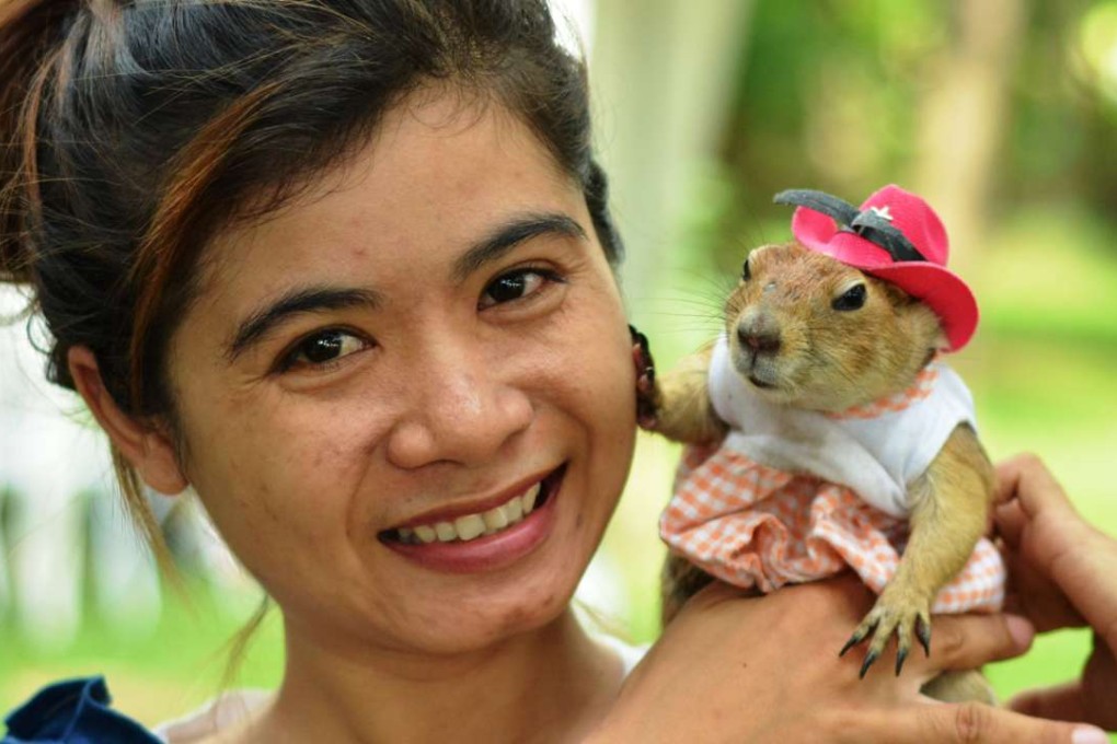 Raweepach Promboot, a Bangkok sales assistant, with her prairie dog Tongkhao in Bangkok. Photos: Tibor Krausz