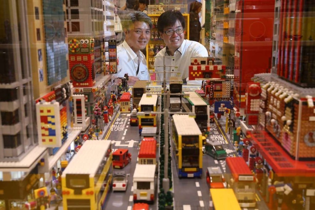 (From left) Andy Hung and Alex Hui pose for a picture with their Lego model of Mong Kok. Photo: Sam Tsang