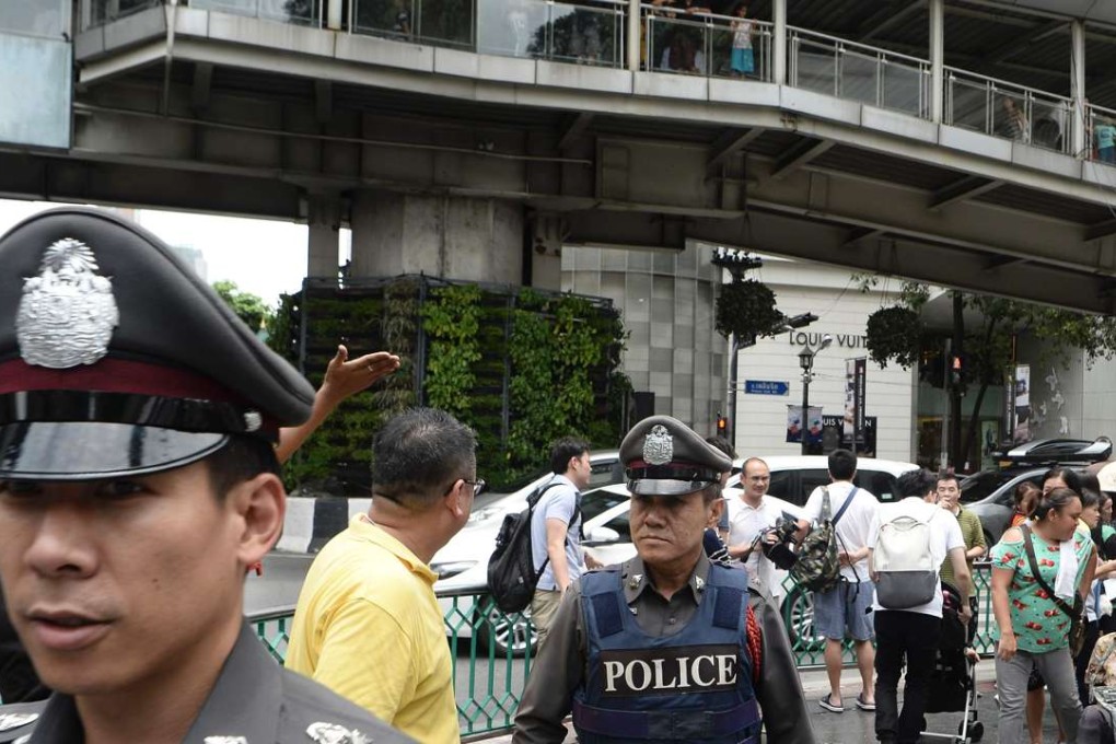 Thai police patrol the area near the Erawan Shrine, the site of a bombing. Photo: AFP