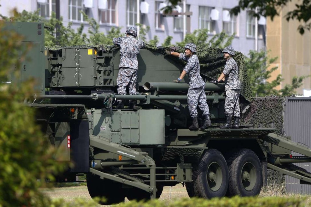 Japan Self-Defence Force members set up a PAC-3 Patriot missile unit in June, deployed in case of a North Korean rocket launch at the Defence Ministry in Tokyo. Photo: AP