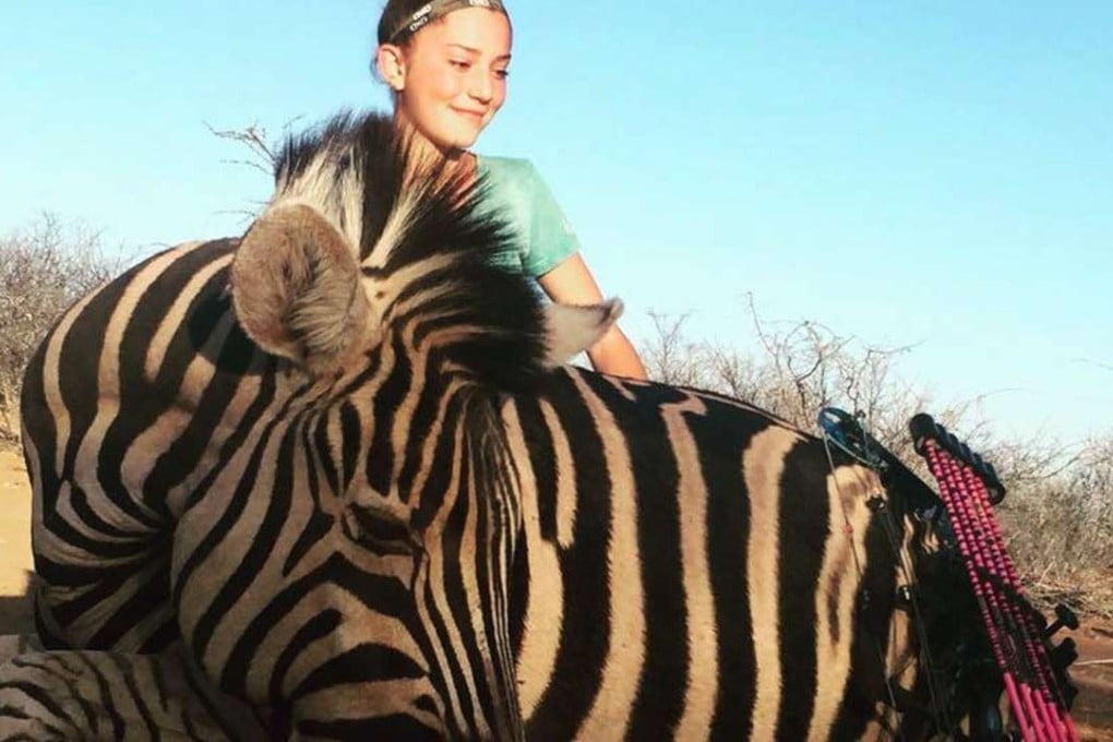 Aryanna Gourdin posing with ‘her dream hunt’, a zebra.