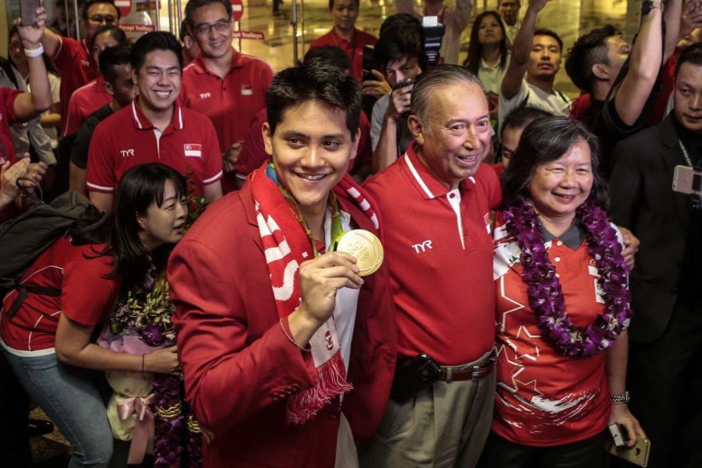 Joseph Schooling arrived back in Singapore to a heroes welcome. Photo: EPA