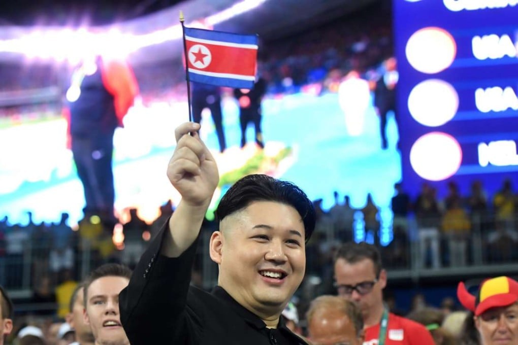 A look-alike of North Korean President Kim Jong-un poses in the stands prior to the Track and Field events at the Olympic Stadium in Rio. Photo: EPA