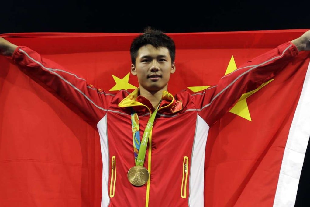 China’s Chen Aisen celebrates winning gold in the men’s 10-metre platform diving final. Photo: AP