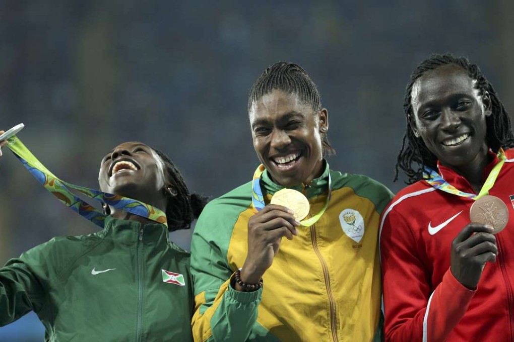 Gold winner Caster Semenya of South Africa celebrates alongside silver medal winner Francine Niyonsaba of Burundi and bronze medallist Margaret Nyairera Wambui of Kenya. Photo: Reuters