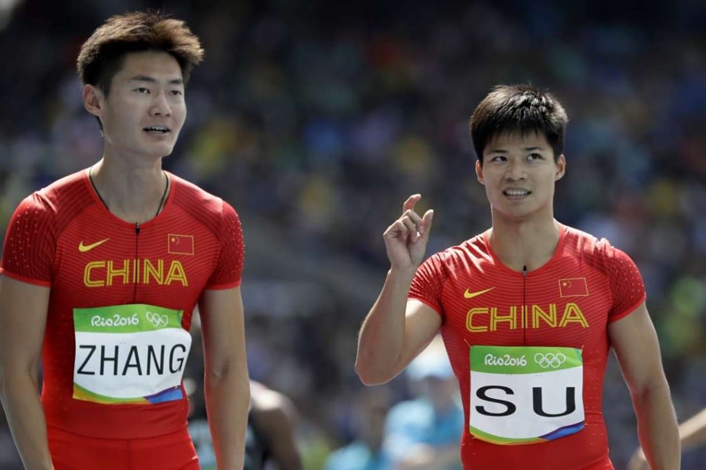 Sprinter Su Bingtian (R), pictured with Peimeng Zhang, believes China are just short of having a relay team to challenge the Japanese. Photo: AP