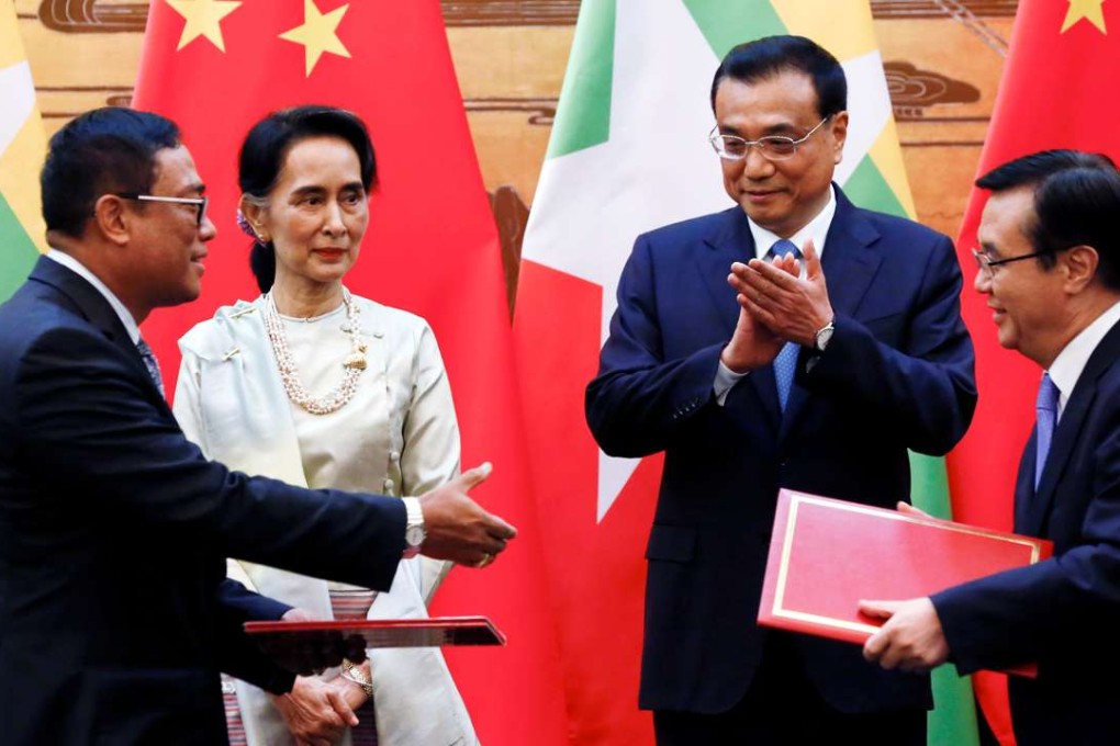 Myanmar State Counsellor Aung San Suu Kyi and Premier Li Keqiang witness the exchange of agreements between the two countries at a signing ceremony in the Great Hall of the People in Beijing on Thursday. Photo: Reuters