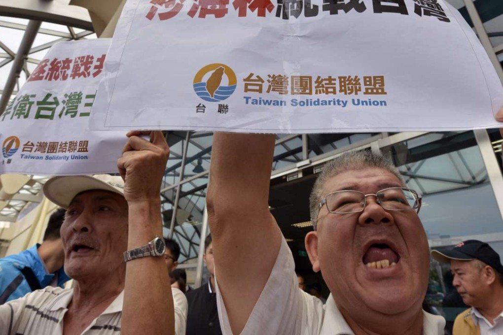 Pro-independence protesters demonstrate against the visit by mainland official Sha Hailin. Photo: AFP
