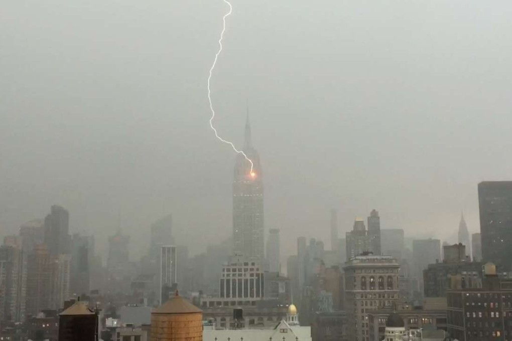 Lightning strikes the Empire State Building during a storm in New York. Photo: AP