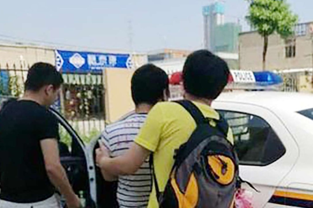 Police arrest a man for the theft. Photo: SCMP Pictures
