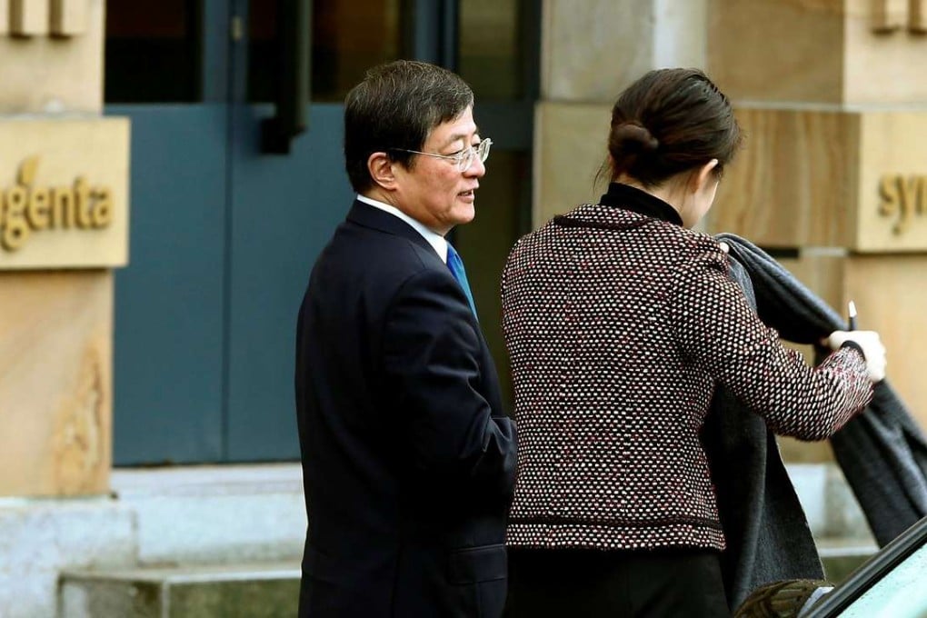 Ren Jianxin (L), chairman of China National Chemical Corp, arrives at the headquarters of Swiss agrochemicals maker Syngenta in Basel, Switzerland, last February. Photo: Reuters