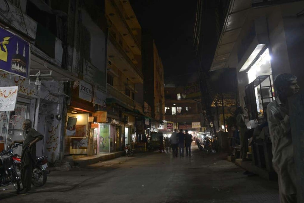 A thriving night spot where, for centuries, women would dress up and lure men from their balconies, is now dark, as the world’s oldest business moves online. Photo: AFP