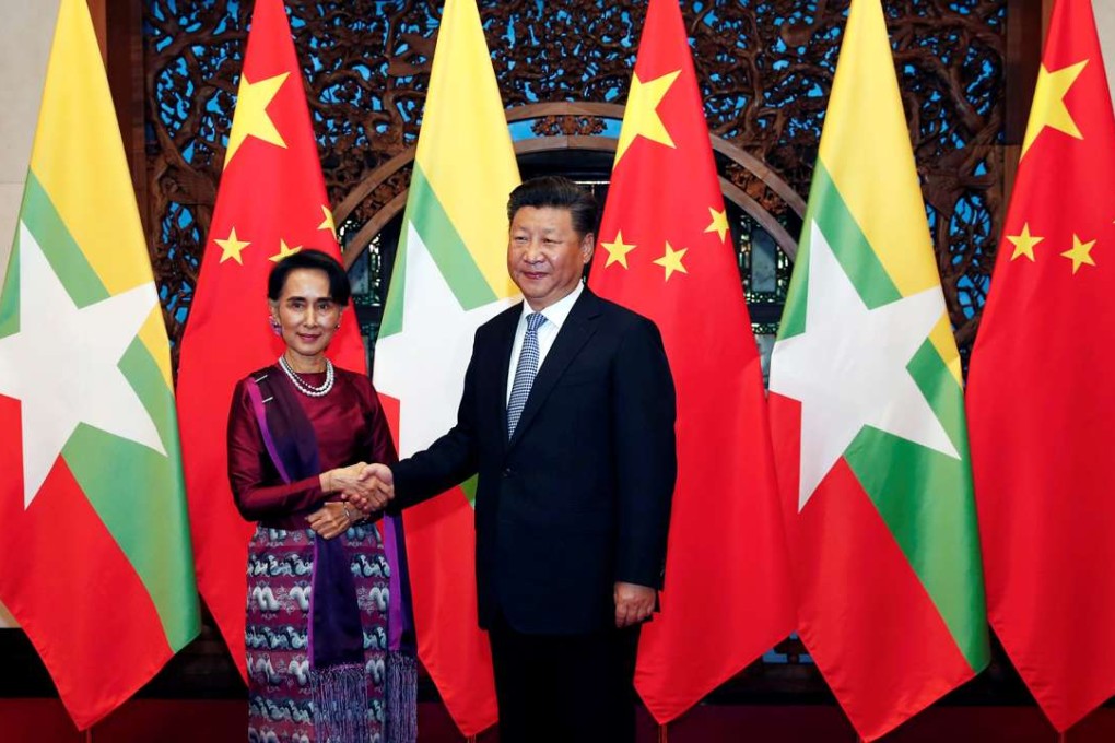 Myanmar State Counsellor Aung San Suu Kyi and President Xi Jinping pose for the media before their meeting at the Diaoyutai State Guesthouse in Beijing on August 19. Photo: Reuters