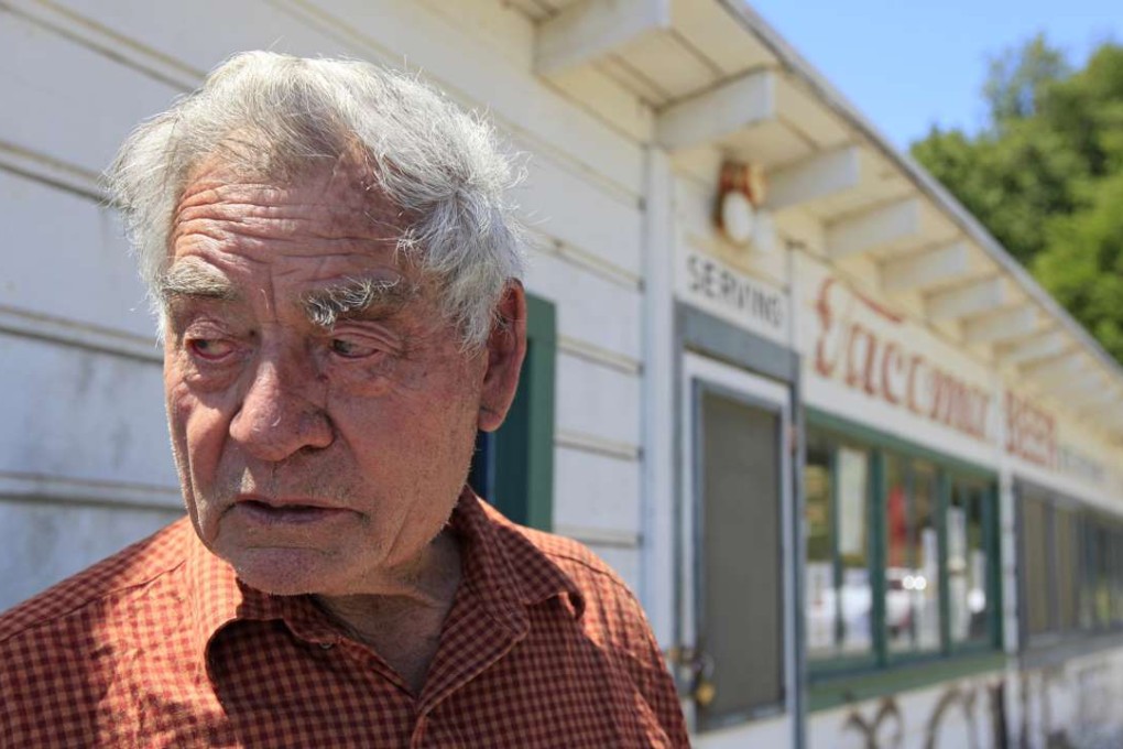 In this July 15, 2011, photo, park resident Frank Quan stands outside the store he ran at China Camp State Park, in California. Photo: AP