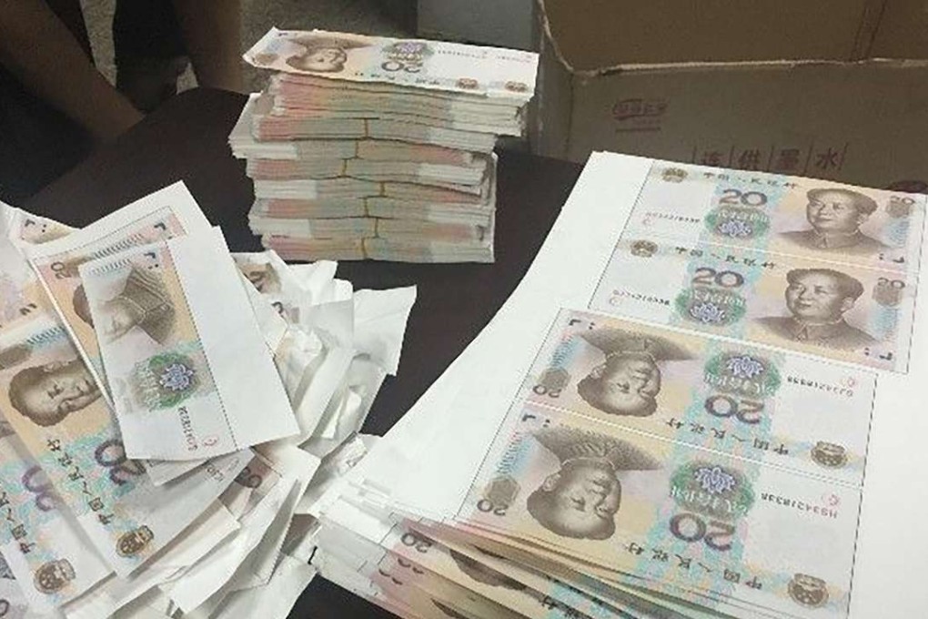 Police found bundles of fake notes at the home of two men. Photo: SCMP Pictures