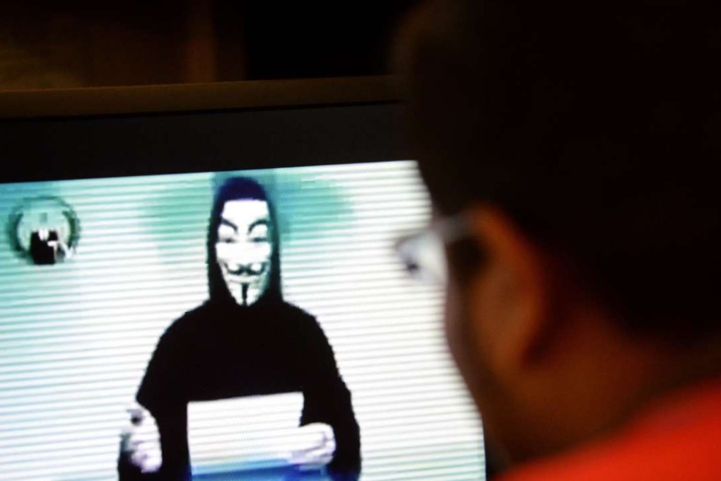 A person claiming to speak for activist hacker group Anonymous is seen issuing a warning throught a video circulated online. Photo: AFP