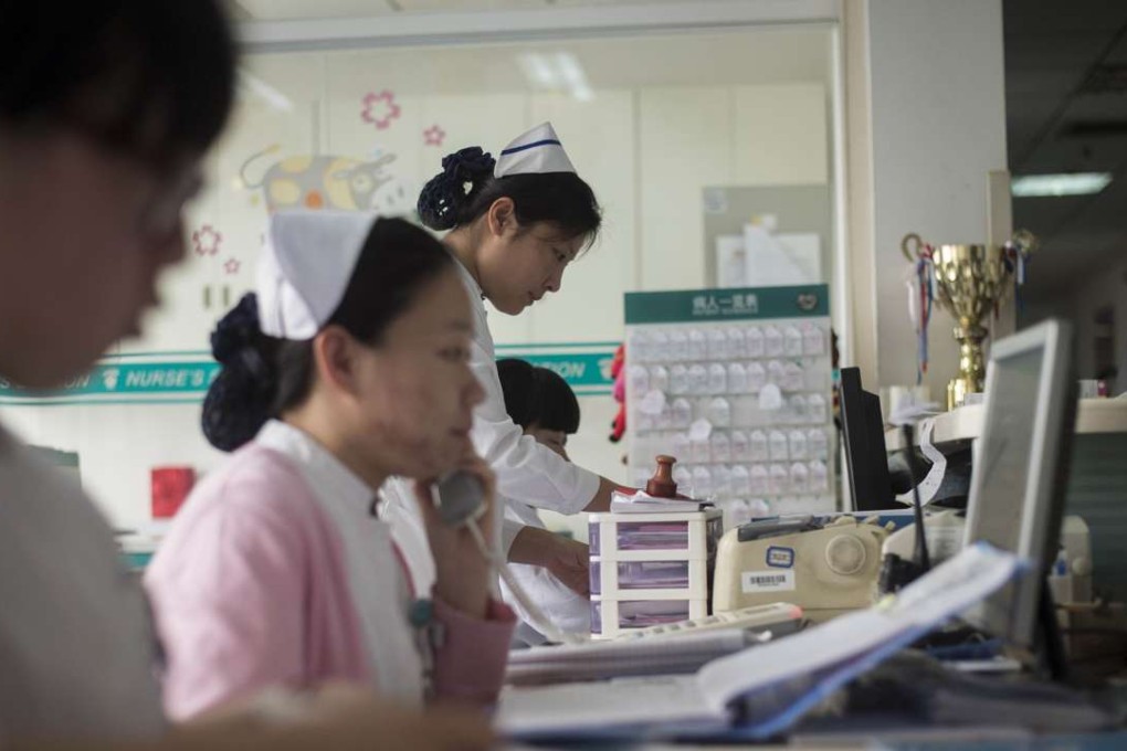 Nurses work at the Beijing Tongren Hospital. More mainlanders are willing to pay health insurance to gain access to the ailing public health system. Photo: AFP