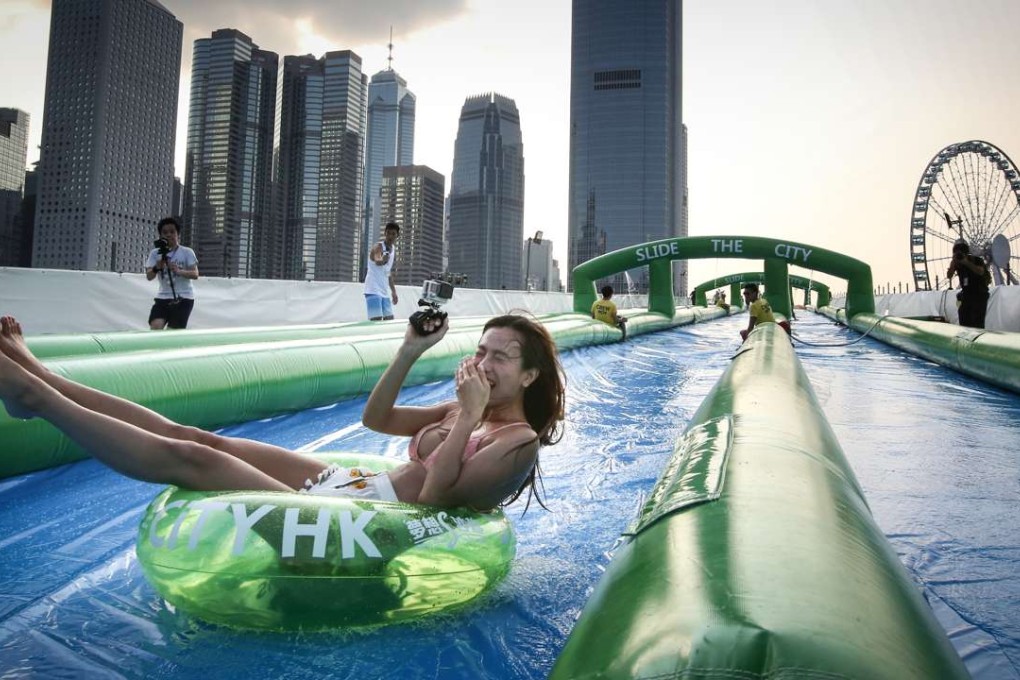 A woman tries out the Slide the City facilities at the Central Harbourfront. Photo: Edward Wong