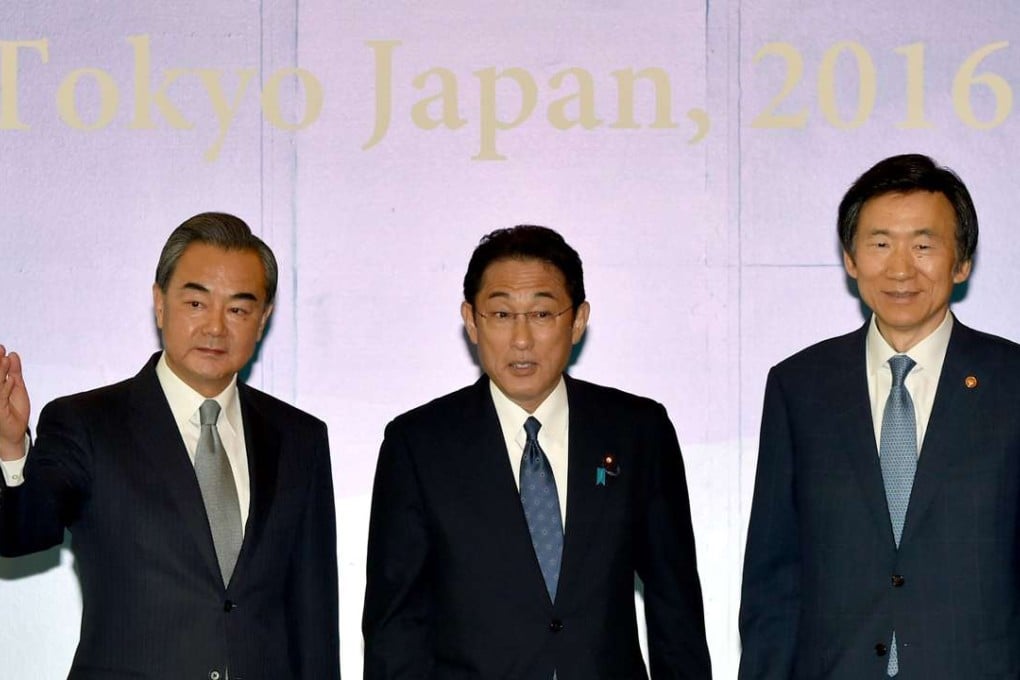 Wang Yi (left) pictured with Japanese Foreign Minister Fumio Kishida (centre) and his South Korean counterpart Yun Byung-Se at their meeting in Tokyo. Photo: Reuters