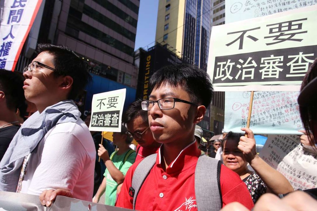 Disqualified candidate Yeung Ke-cheong (Centre) marches to Central Government Offices in Admiralty from Causeway Bay as part of the protest against disqualification of Legco candidates. Photo: Dickson Lee