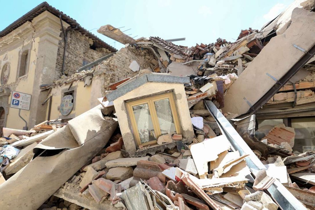 Rubble from damaged property covers a street following an earthquake in Amatrice, Italy, destroying small mountain towns and burying victims in the rubble of collapsed buildings. Photo: Bloomberg