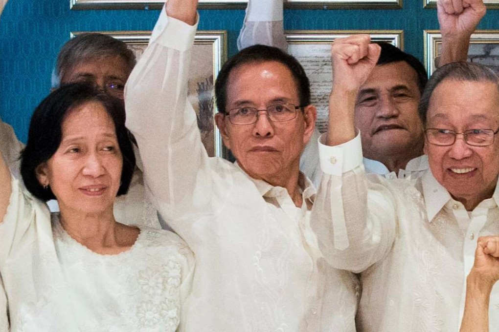 Communist Party of the Philippines' Benito Tiamzon (centre) and his wife Wilma Austria Tiamzon (left) next to Jose Maria Sison, the exiled founder of the Communist Party. Photo: Reuters