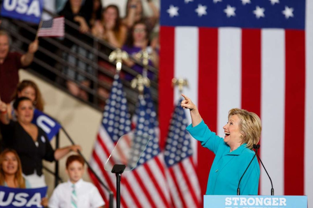 Hillary Clinton gestures to attendees during a campaign event in Reno, Nevada. Photo: Bloomberg