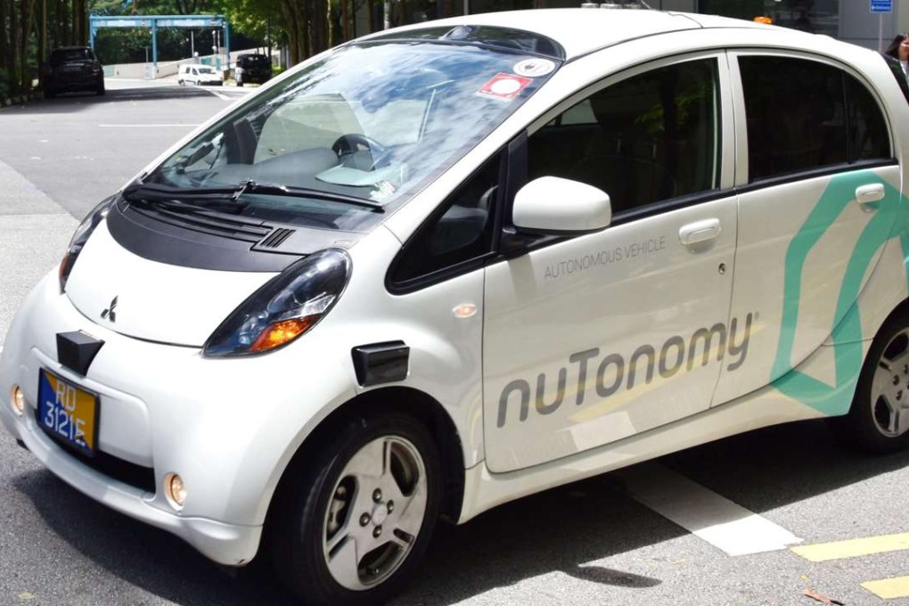 An autonomous taxi turns at an intersection during a test drive in Singapore. Photo: Kyodo
