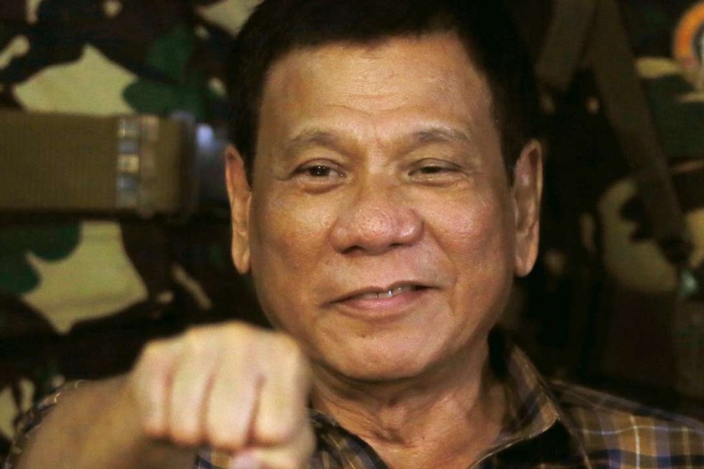 Philippine President Rodrigo Duterte gestures with a fist bump during his visit to the Philippine Army’s Camp Mateo Capinpin at Tanay township, Rizal province east of Manila. Photo: AP