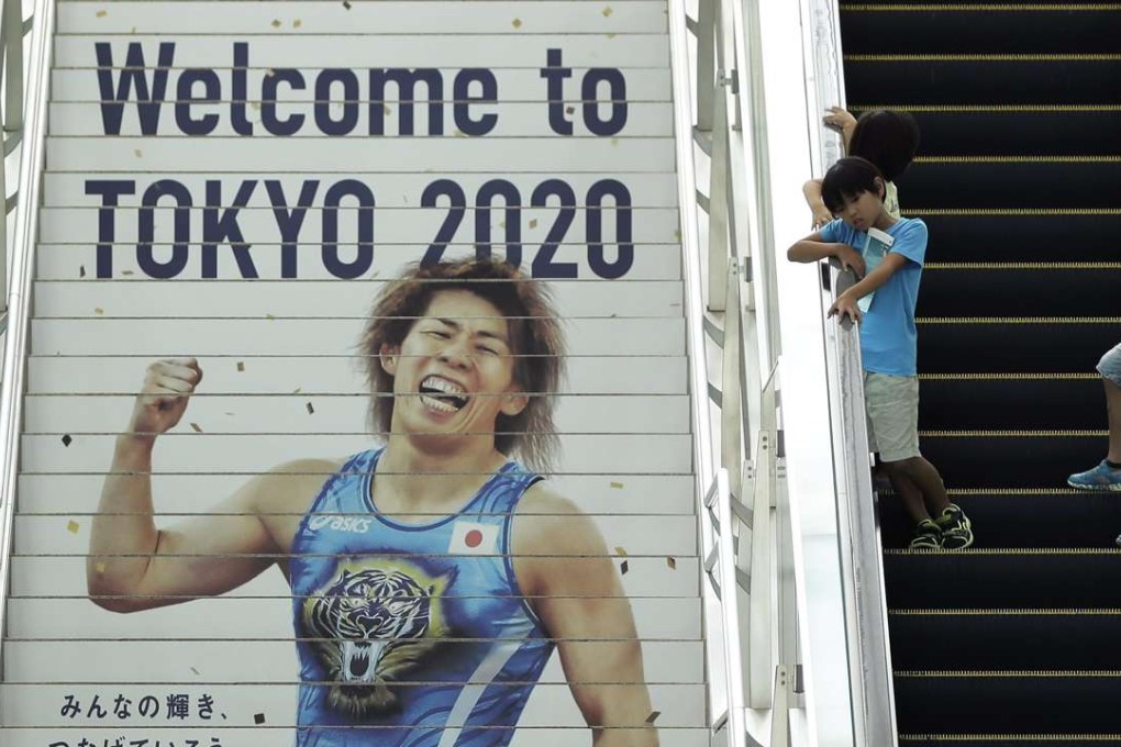 The Tokyo 2020 emblem is displayed at Haneda airport for the arrival of Olympic flag, marking the official start of preparations for the Olympic Games. Photo: EPA