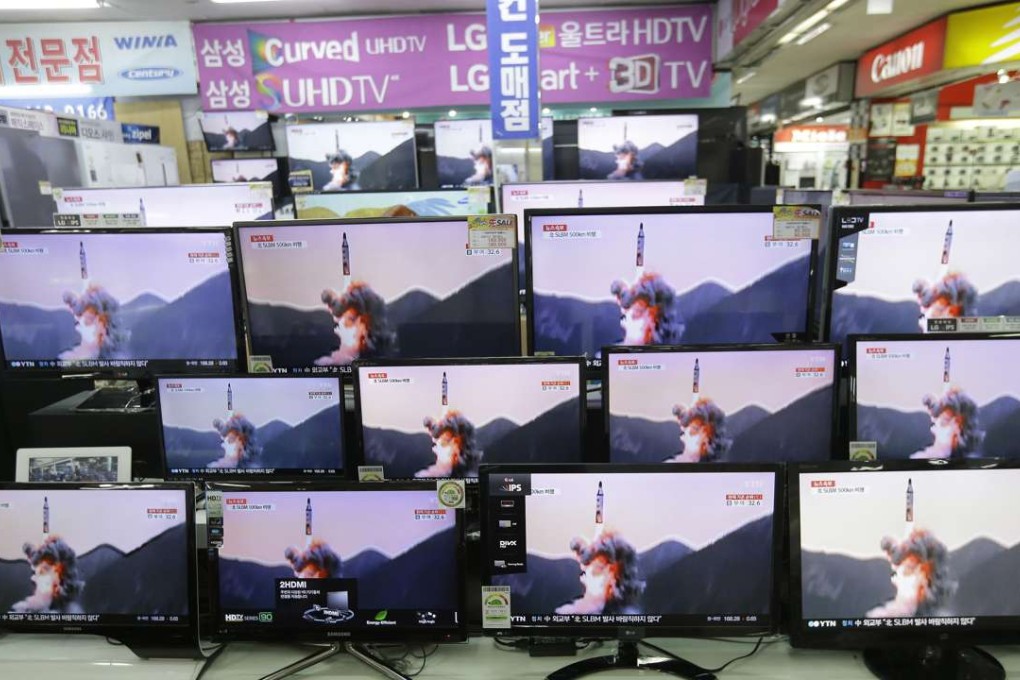 Television screens show file footage of a North Korea's ballistic missile that North Korea claimed to have launched from underwater at the Yongsan Electronic store in Seoul. Photo: AP