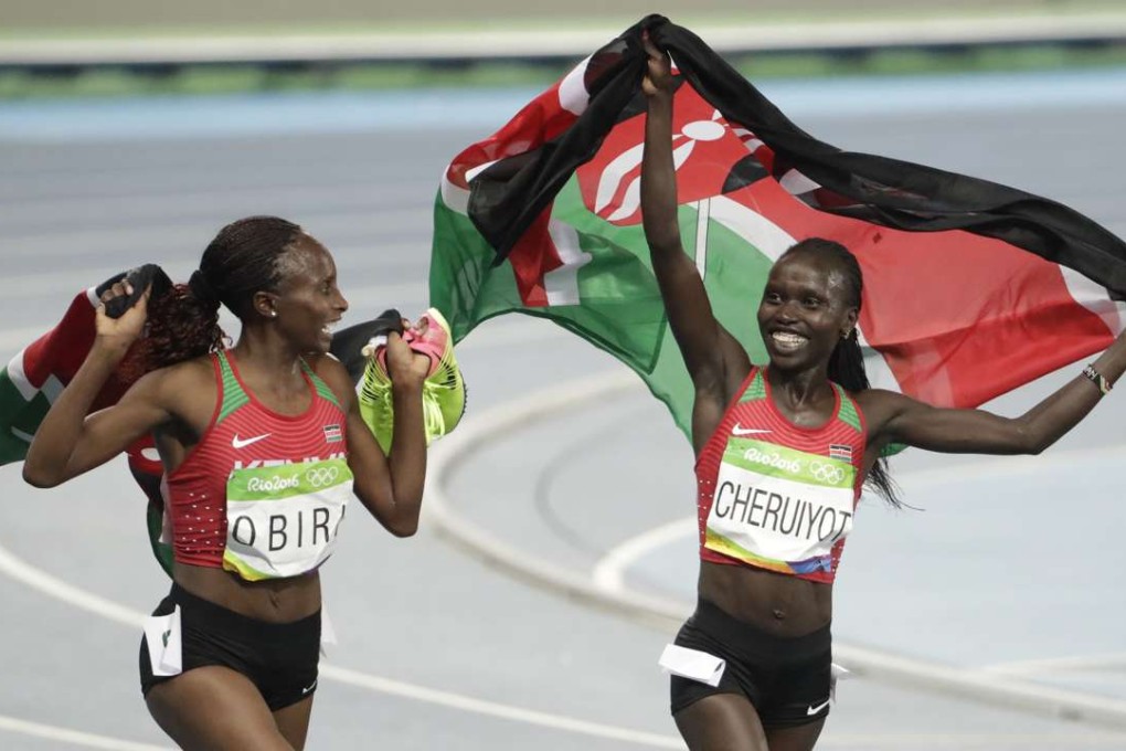 Kenya's Vivian Jepkemoi Cheruiyot (right) celebrates winning the gold medal in the women's 5000 metres with silver medallist and compatriot Hellen Onsando Obiri. Photo: AP