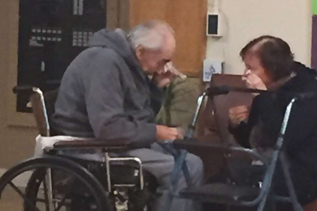 The photo by Ashley Bartyik shows her grandparents Wolfram and Anita Gottschalk crying as they say goodbye near the end of a visit with each other in Wolfram's elderly care home. Photo: AP