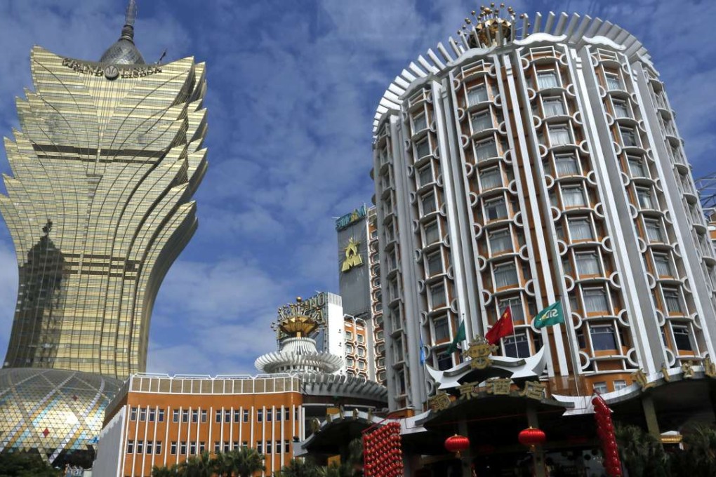 Tourists gather in front of Casino Lisboa in Macau. Photo: AP