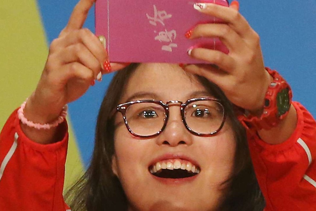 Swimmer Fu Yuanhuiattends "A Date with Mainland Olympians" at Queen Elizabeth Stadium, Wan Chai’s candid yet goofy style has gained her a huge fanbase both on the mainland and in Hong Kong especially. Photo: Felix Wong