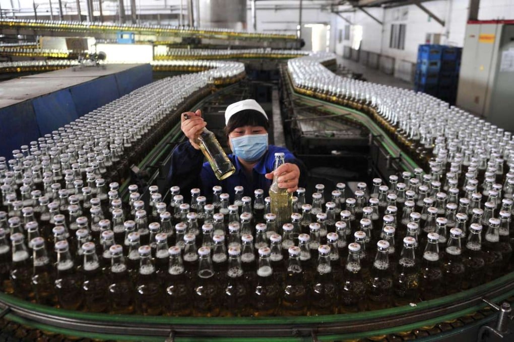 A beer assembly line inside a brewery in Shenyang, Liaoning province. Such automation could keep factory jobs and provide more high-end jobs. But as China moves up the value chain – and no longer has an endless supply of cheap labour – India and the ASEAN member countries are expected to fill its role. Photo: Reuters