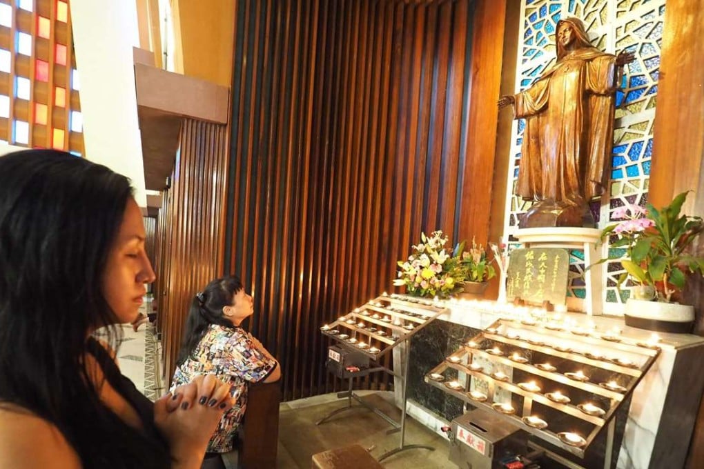 Roman Catholic worshippers in Taipei. Photo: EPA