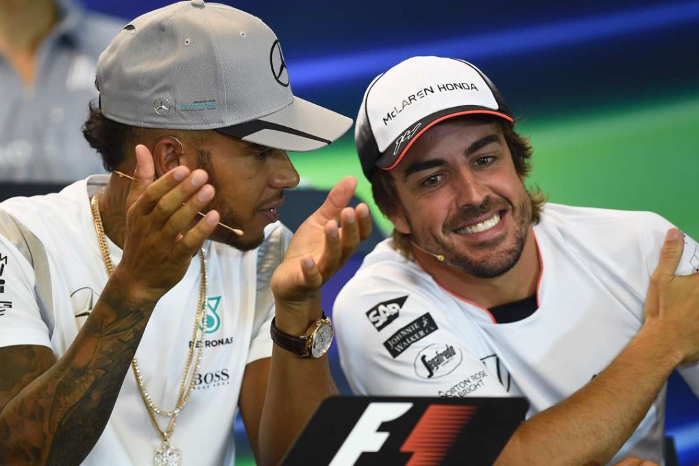 Lewis Hamilton (left) with Fernando Alonso. Photo: AFP