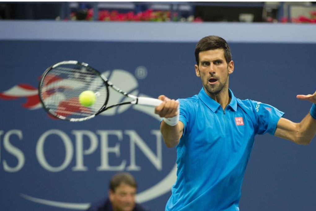 Novak Djokovic returns against Jerzy Janowicz of Poland during their US Open. Photo: AFP