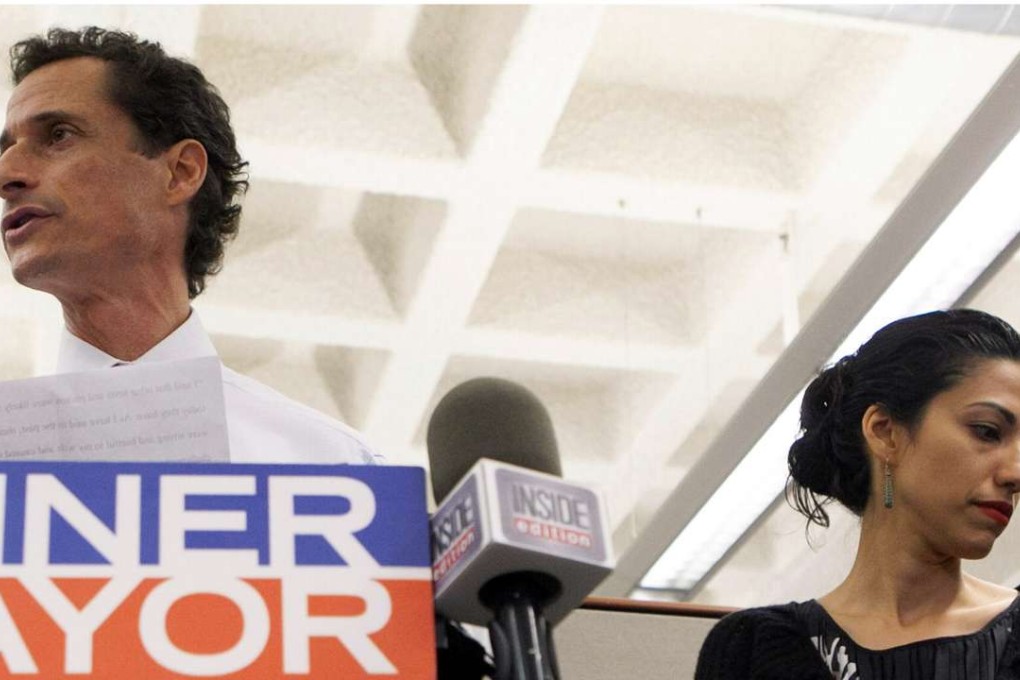 Anthony Weiner and his wife Huma Abedin attend a news conference in New York in 2013. Photo: Reuters