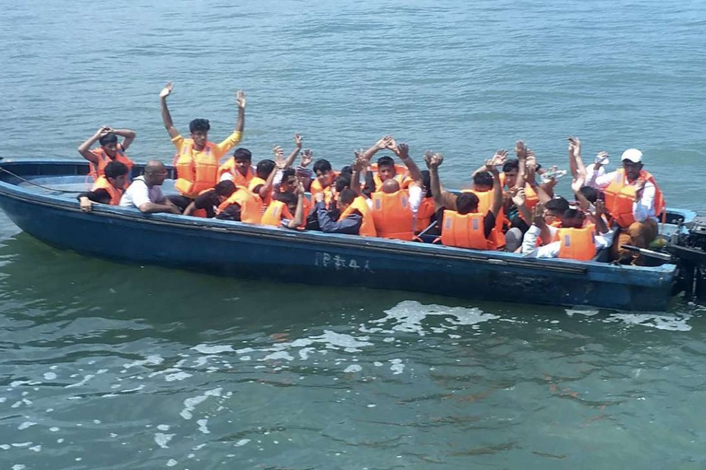 ***ONE TIME USE ONLY, PLEASE CLEAR THE COPYRIGHTS BEFORE RE-USE - OTUO*** Self-claimed asylum-seekers from South Asian were forced to sail themselves across the border into Hong Kong as mainland snakeheads apparently refused to smuggle them in an effort to avoid being arrested under the new and heftier penalties against them, the Post has learntWhile a quarter of the 1,001 Cantonese-speaking Hong Kong adults polled by the school had a negative view of asylum-seekers – major impressions included “fake refugees” and “criminals” – two-thirds were neutral on claimants. This surfaced after Marine police intercepted a boatload of 25 illegal immigrants from Pakistan in Hong Kong waters at about 1.8km west of Hong Kong International Airport shortly before 11am on Wednesday. The 23 men and two women, aged from 16 to 49, were found packed in an eight-metre sampan, but no mainland smugglers, known as snakeheads, were found on board, according to police. "Initial investigation showed they sailed i