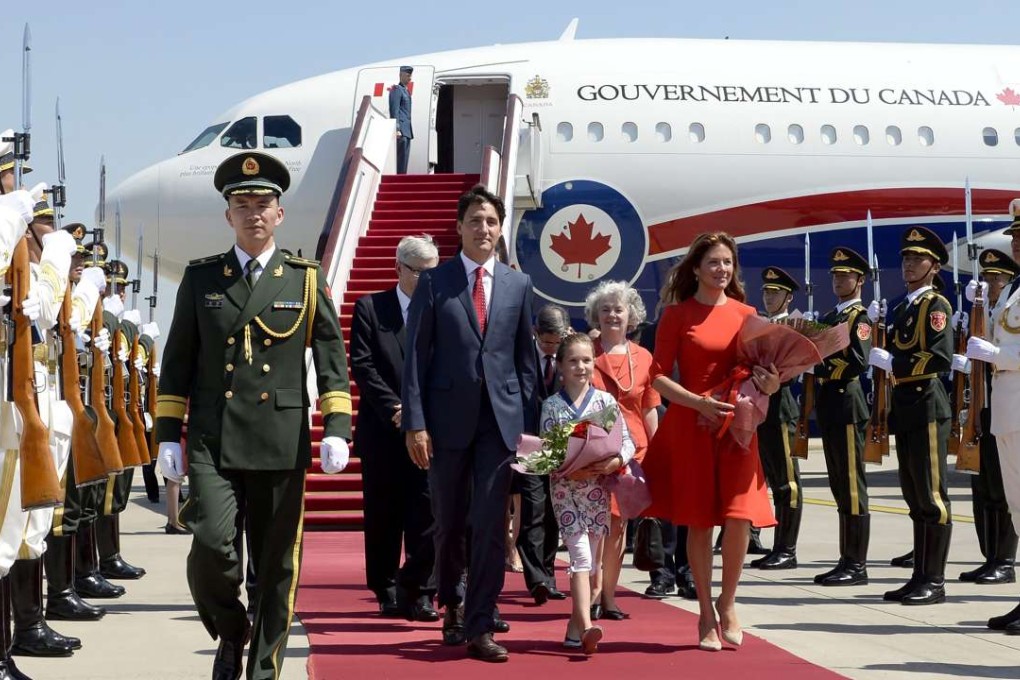Canadian Prime Minister Justin Trudeau arrives in Beijing on Tuesday with his wife Sophie Gregoire Trudeau and daughter Ella-Grace. Photo: AP