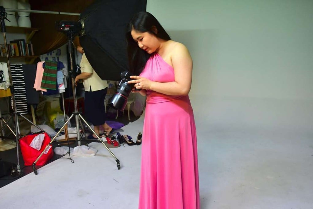 South Korean plus-size model Vivian Geeyang Kim checks how she looks during a photo shoot in a studio in Seoul. Photo: AFP