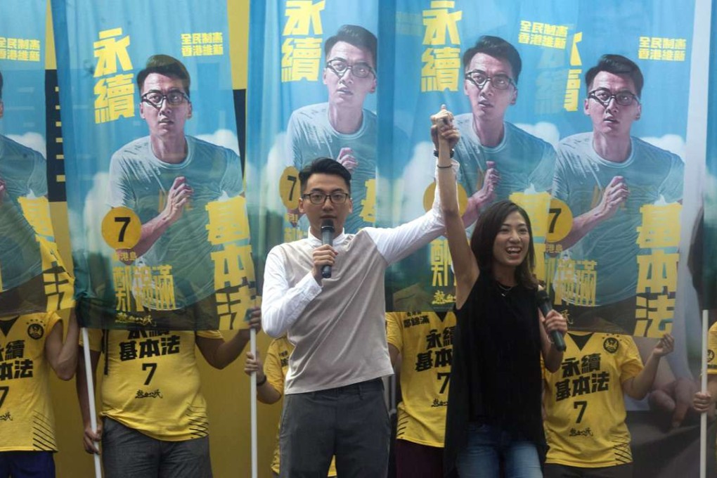 Civic Passion candidates Cheng Kam-mun and Chung Yuen-wun, who are contesting the election in Hong Kong Island, speak at a rally in Tsim Sha Tsui East. Photo: EPA