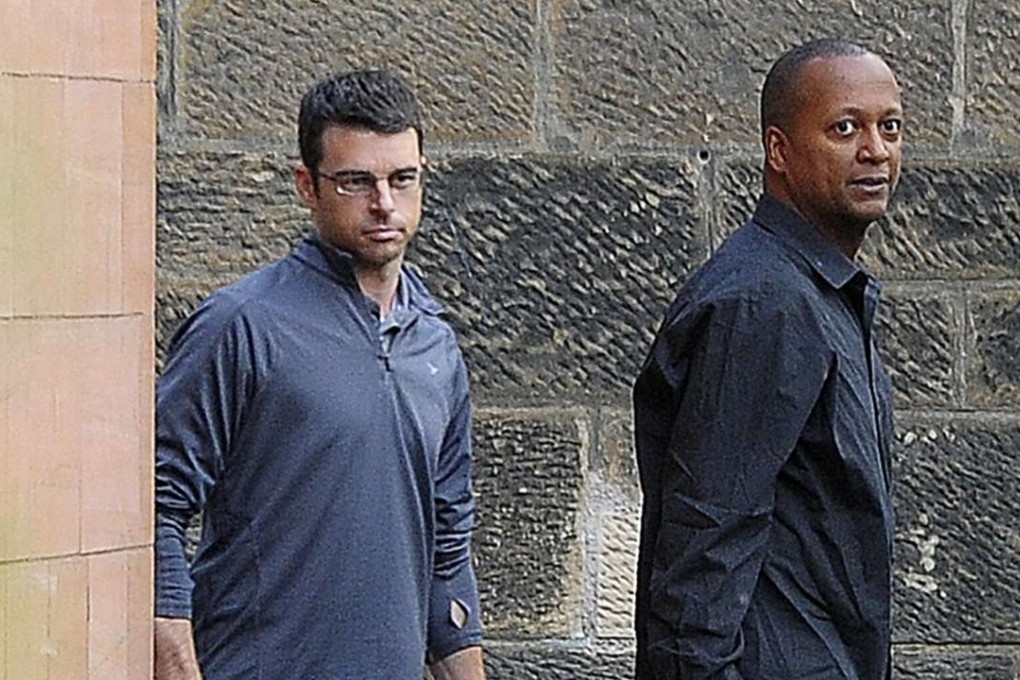 United Airlines pilots Brady Grebenc (left) and Carlos Licona are pictured as they leave Paisley Sherrif Court in Glasgow after being freed on bail. The two pilots were arrested in Scotland on suspicion of being under the influence of alcohol as they prepared to fly a passenger plane to the United States. Photo: AFP