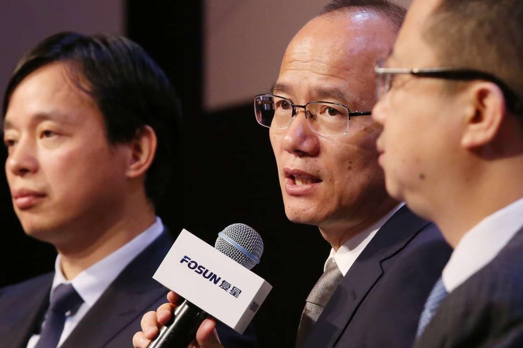 Fosun chairman Guo Guangchang (centre) says the company aims to build an integrated health-care system in China. Photo: May Tse