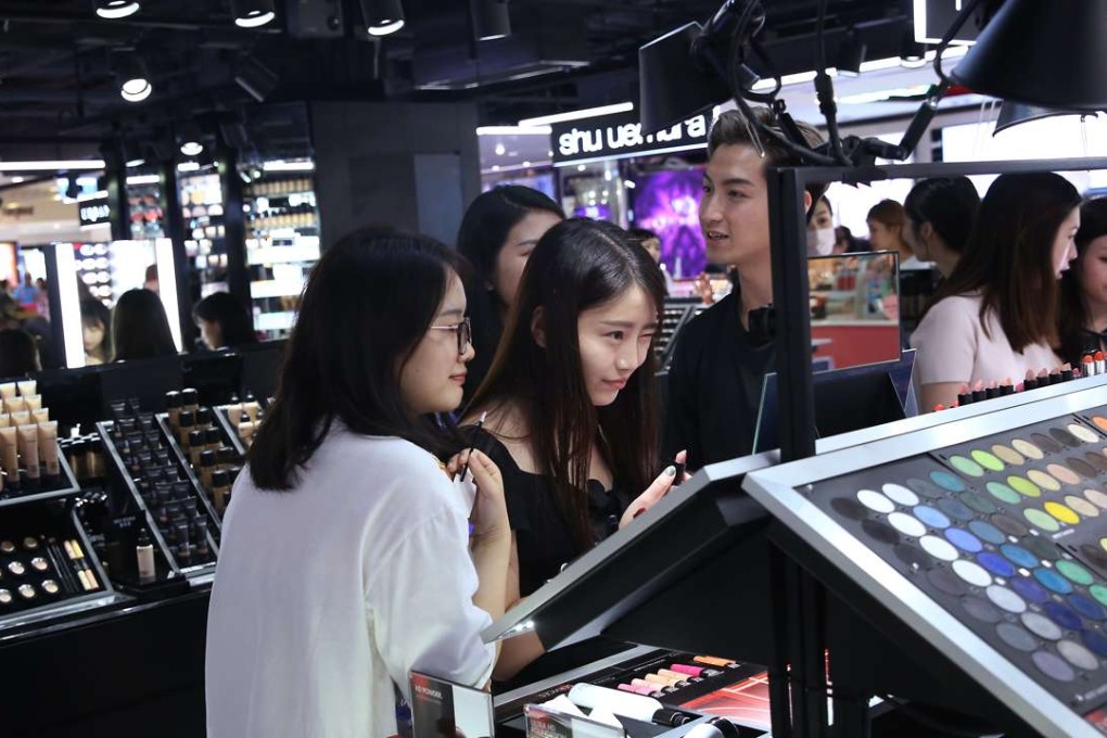 Customers choose make-up products at a shop in Tsim Sha Tsui. Photo: K. Y. Cheng