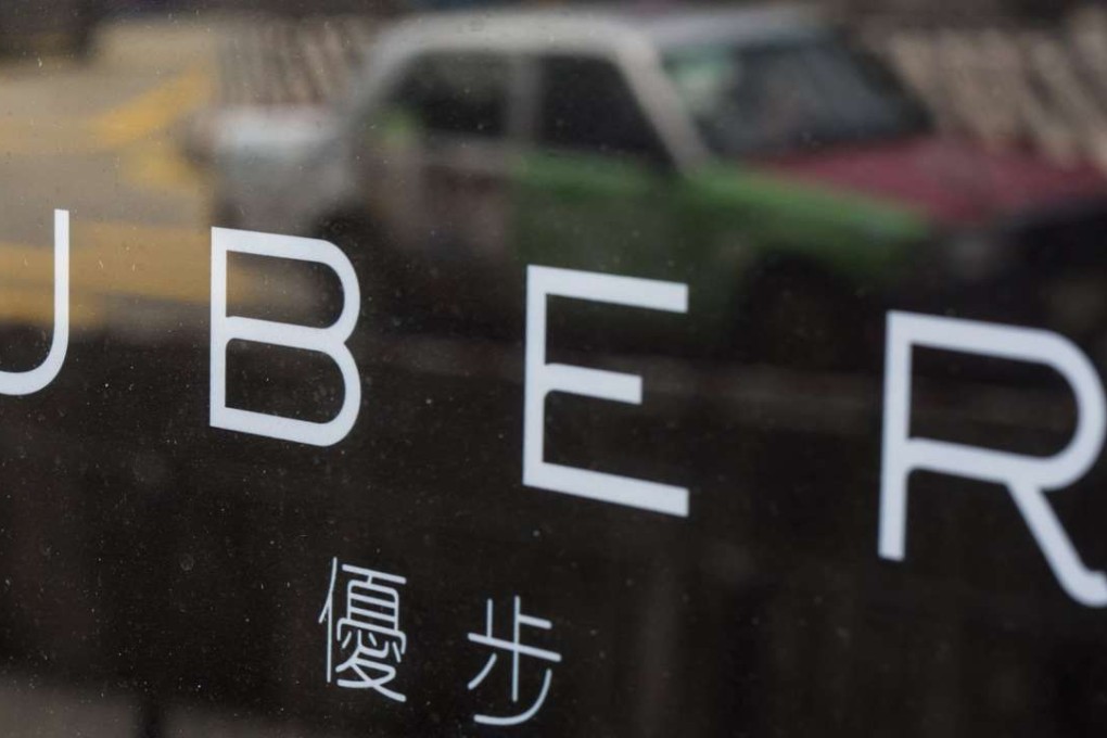 Car-hailing firm Uber is putting the brakes on its taxi and van services in Hong Kong. Photo: Reuters