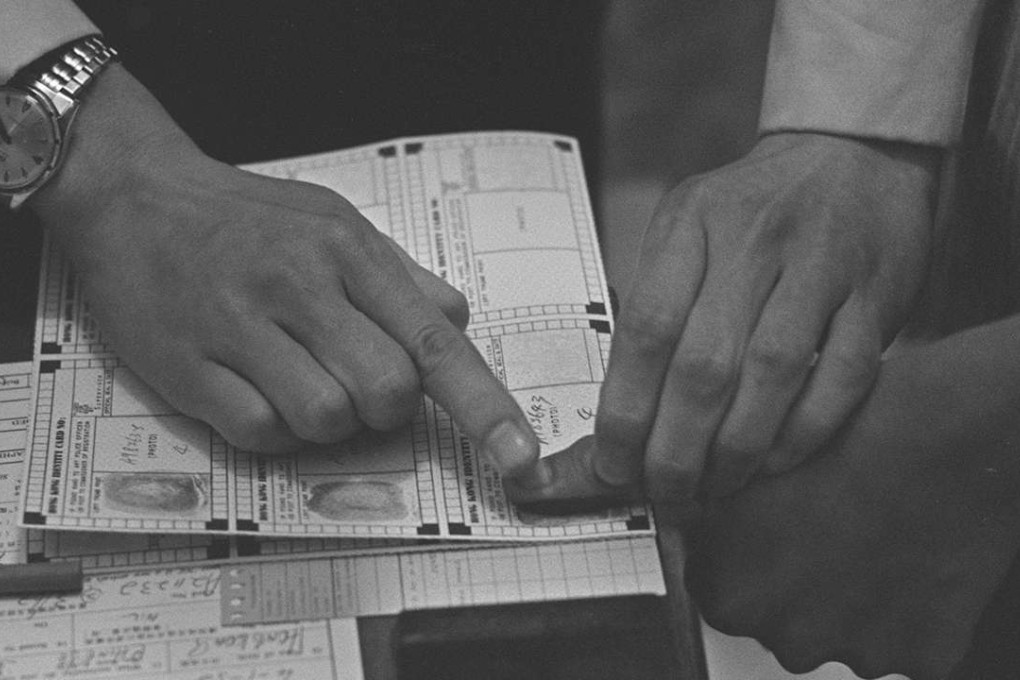 An applicant for a Hong Kong identity card undergoes fingerprinting in 1969. Picture: SCMP